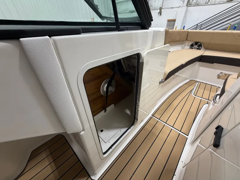 Slide: The Image of Interior of 2026 Sea Ray SDX 270 with open storage compartment. - 33