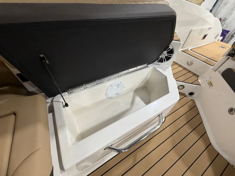 Slide: The Image of 2026 Sea Ray SDX 270 boat with open storage compartment. - 40