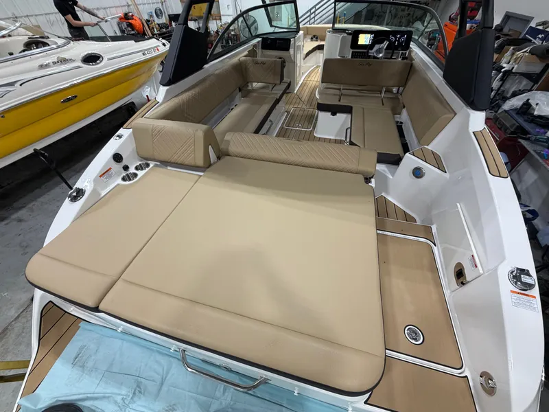 Slide: The Image of Interior of 2026 Sea Ray SDX 270 with beige upholstery. - 41