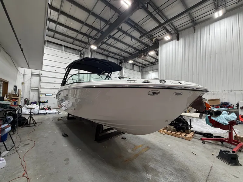 Slide: The Image of 2026 Sea Ray SDX 270 boat in a workshop. - 6