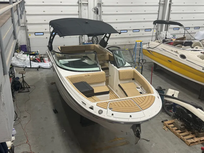 Slide: The Image of 2026 Sea Ray SDX 270 boat in a workshop. - 7