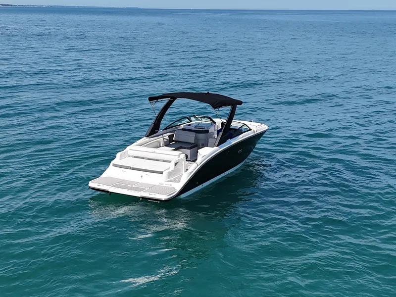 Slide: The Image of 2026 Sea Ray SDX 290 on calm water, featuring sleek design and black canopy. - 3