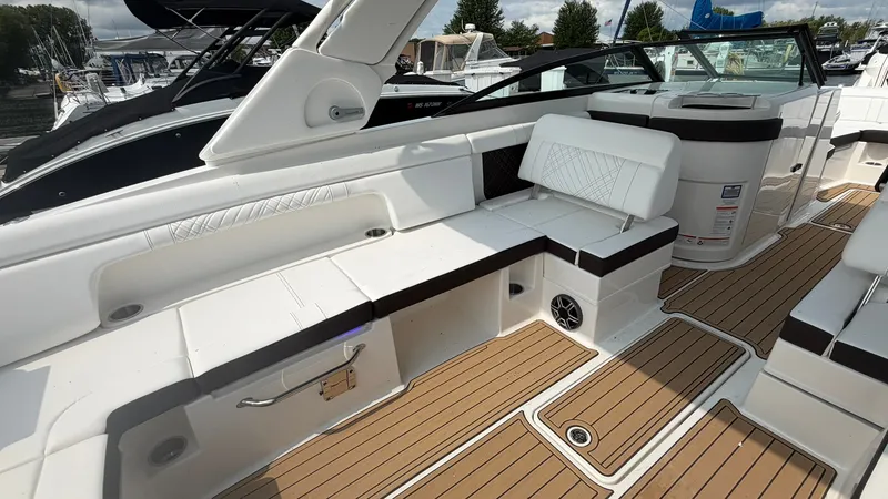 Slide: The Image of The image shows the cockpit of a 2026 Sea Ray SDX 290 with sleek seating and teak flooring. - 15