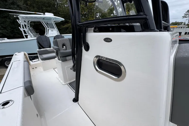 Slide: The Image of 2026 Sea Born LX26 Center Console boat interior with seating and console details. - 24