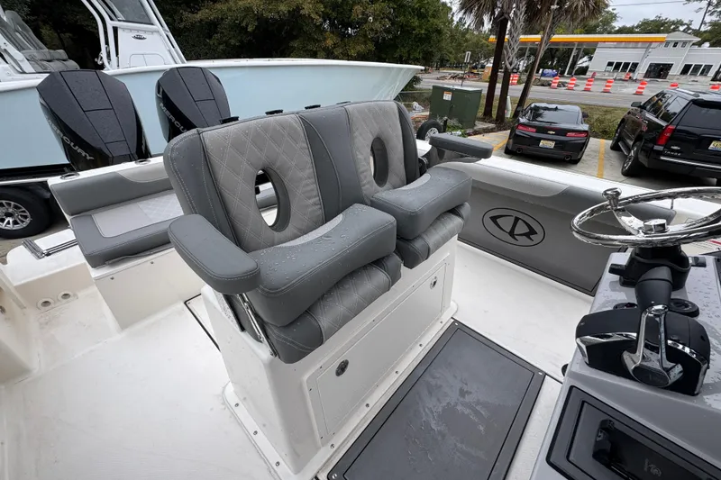 Slide: The Image of 2026 Sea Born LX26 Center Console boat with dual seats and steering wheel. - 34