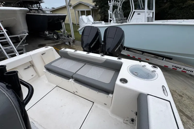 Slide: The Image of 2026 Sea Born LX26 Center Console boat with dual Mercury engines and seating area. - 37