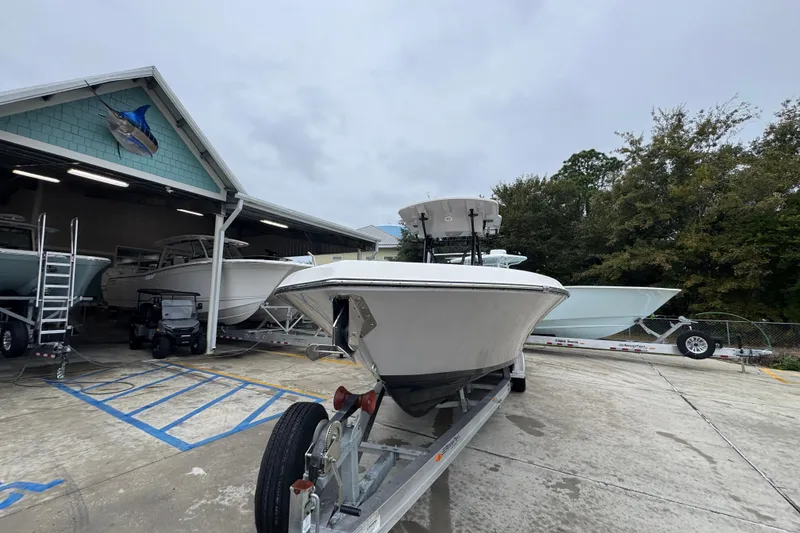Slide: The Image of 2026 Sea Born LX26 Center Console boat on trailer at marina. - 5