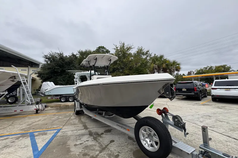 Slide: The Image of 2026 Sea Born LX26 Center Console boat on trailer in parking lot. - 7