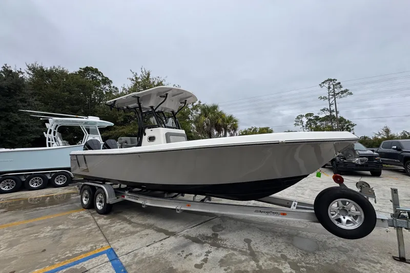 Slide: The Image of 2026 Sea Born LX26 Center Console boat on trailer in parking lot. - 8