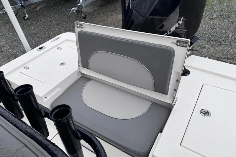 Slide: The Image of 2021 Sea Born FX22 Bay boat with cushioned seating and storage compartments. - 17