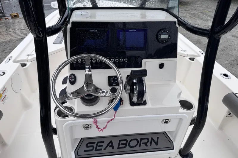 Slide: The Image of 2021 Sea Born FX22 Bay boat console with steering wheel and navigation system. - 20