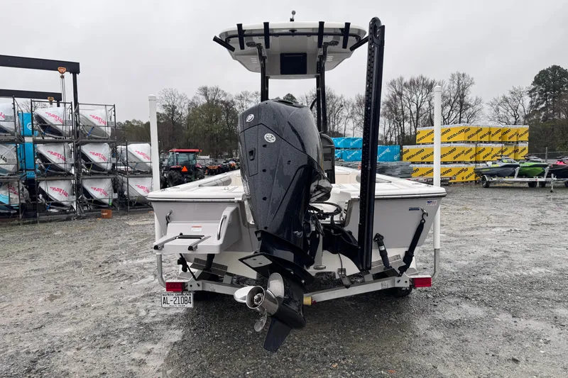 Slide: The Image of 2021 Sea Born FX22 Bay boat with outboard motor, parked on gravel lot. - 4