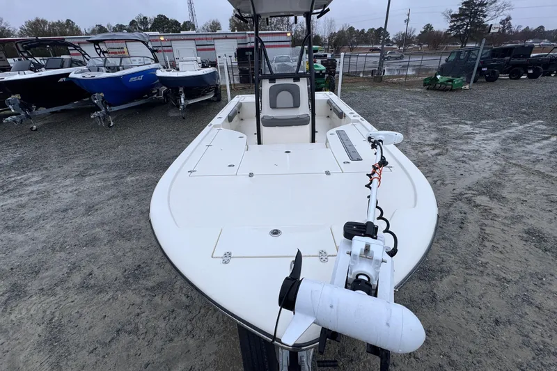Slide: The Image of 2021 Sea Born FX22 Bay boat in a dealership lot, front view. - 9