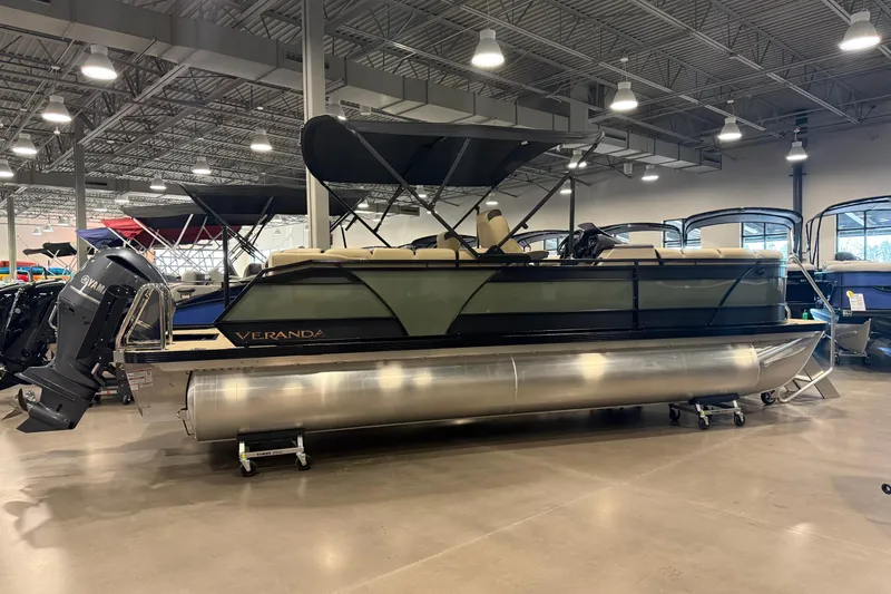 The Image of 2026 Veranda Relax VR235RCP pontoon boat displayed in a showroom. - 0