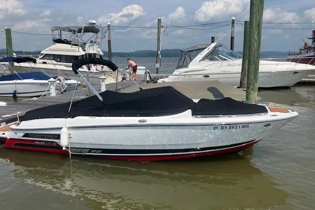 Slide: The Image of 2020 Monterey 238SS Super Sport boat docked at marina, covered and ready for use. - 8