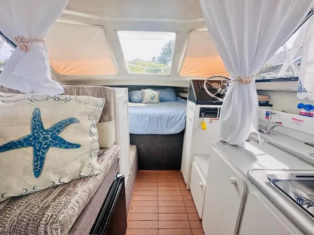 Slide: The Image of Interior of 1994 Bayliner 2858 Ciera with cozy bed and helm area. - 16