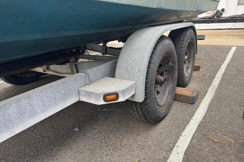 Slide: The Image of Trailer for 1994 Bayliner 2858 Ciera Command Bridge, parked with wooden blocks. - 5