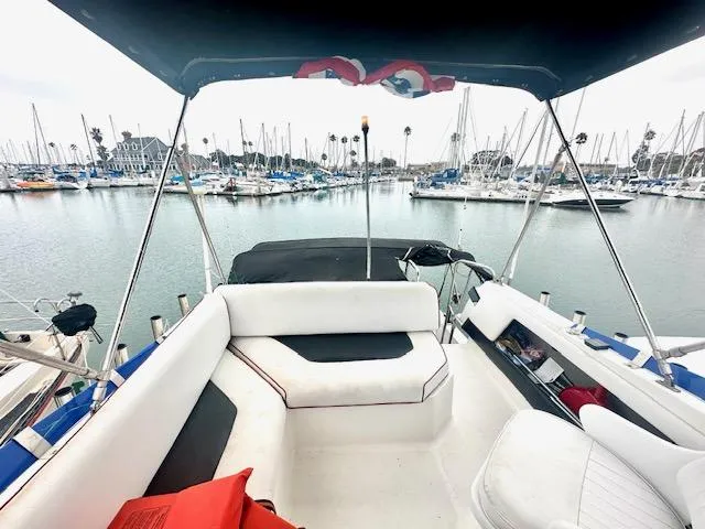 Slide: The Image of 1994 Bayliner 2858 Ciera Command Bridge in marina with yachts. - 9