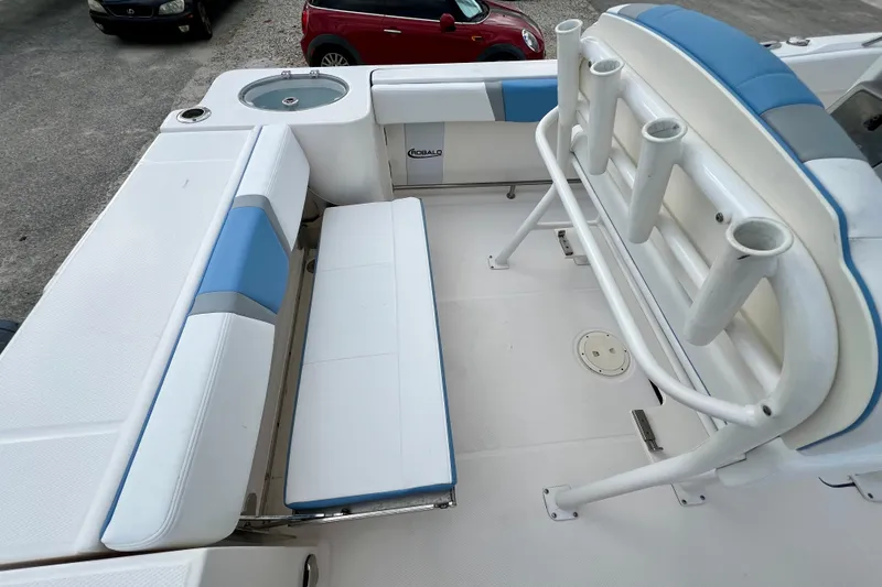 Slide: The Image of 2024 Robalo R230 Center Console boat interior with seating and rod holders. - 10