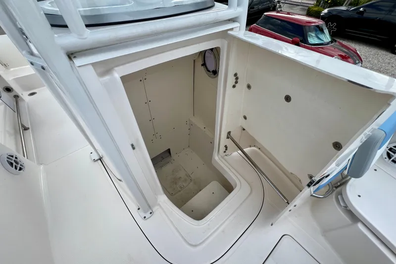 Slide: The Image of 2024 Robalo R230 Center Console boat storage compartment, open and spacious design. - 23