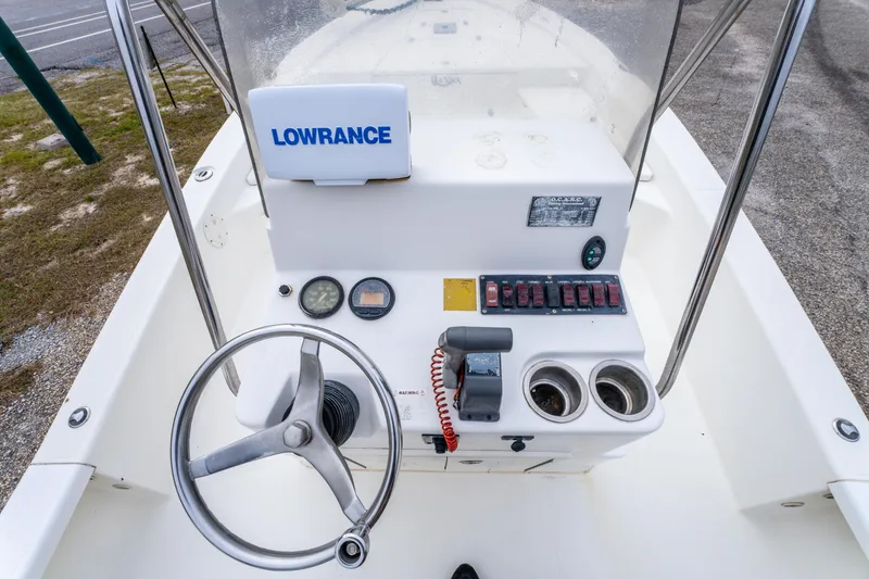Slide: The Image of Steering console of a 2005 BlackJack 224 boat with Lowrance equipment. - 12