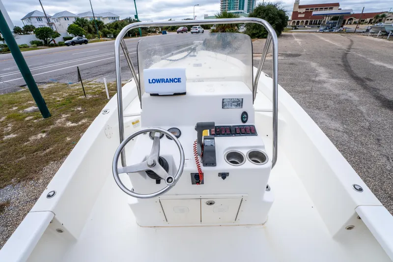 Slide: The Image of 2005 BlackJack 224 boat console with steering wheel and Lowrance equipment. - 13