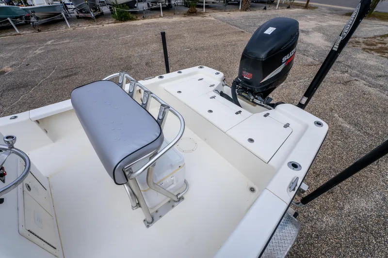 Slide: The Image of 2005 BlackJack 224 boat interior with Suzuki outboard motor and seating. - 19