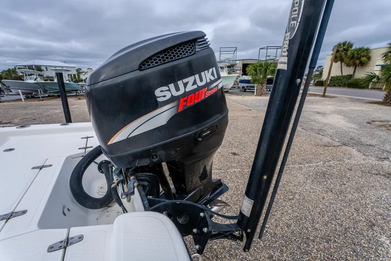 Slide: The Image of Suzuki Four Stroke engine on 2005 BlackJack 224 boat, parked outdoors. - 20