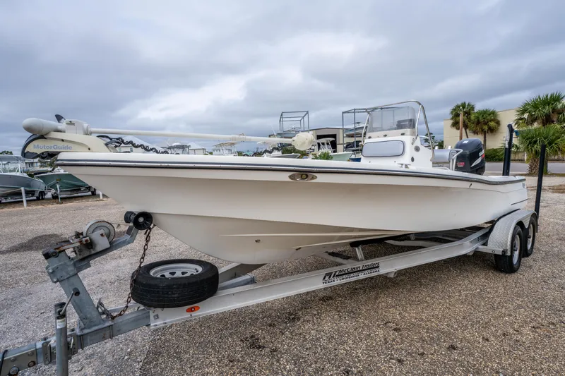 Slide: The Image of 2005 BlackJack 224 boat on trailer, overcast sky, parked outdoors. - 4