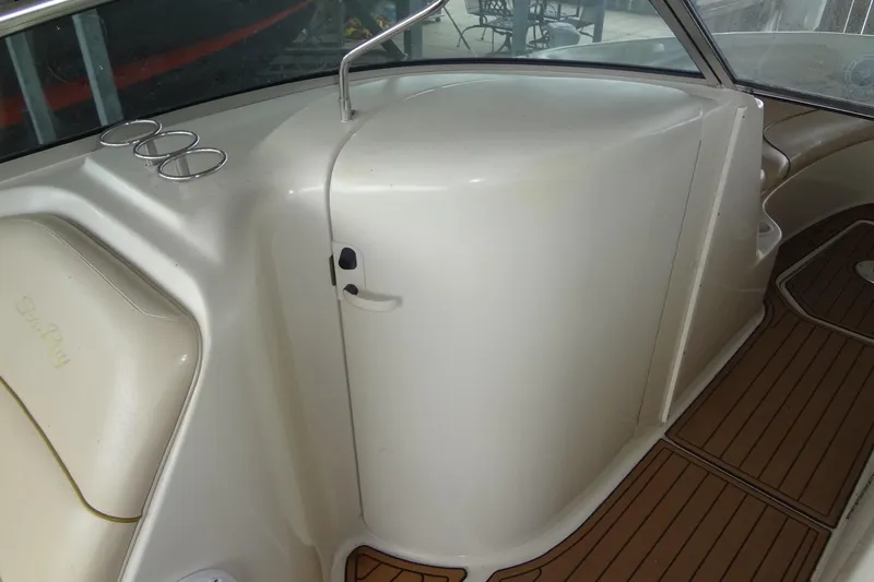 Slide: The Image of Interior of 2000 Sea Ray 240 Sundeck boat with cup holders and seating. - 14