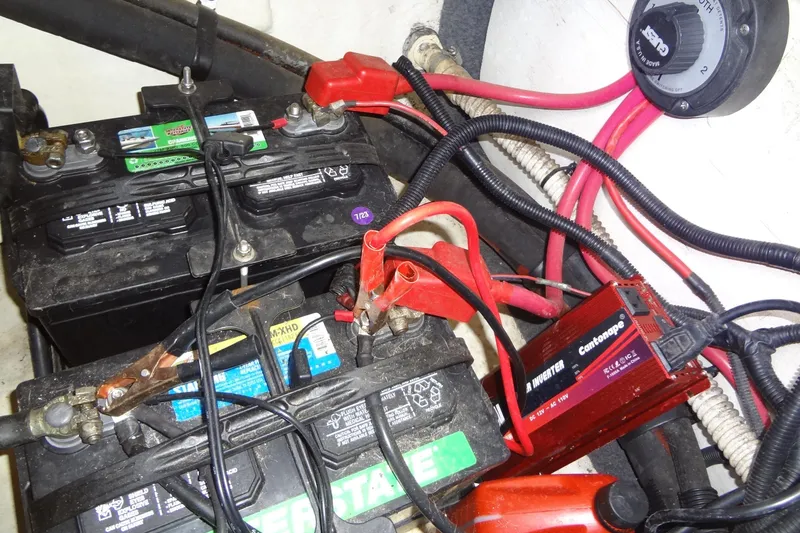 Slide: The Image of Battery setup in a 2000 Sea Ray 240 Sundeck boat with inverter and wiring. - 26