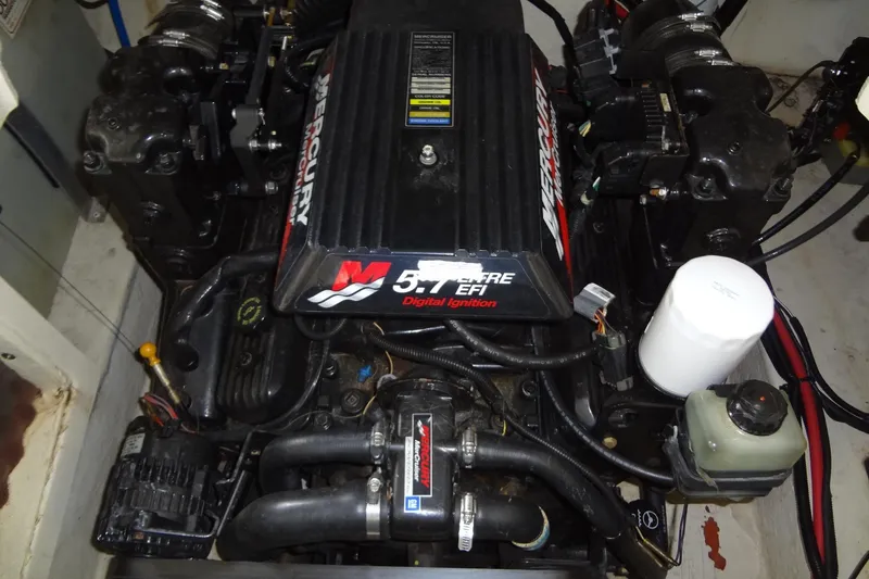 Slide: The Image of Engine of a 2000 Sea Ray 240 Sundeck boat, featuring Mercury 5.7L EFI. - 27