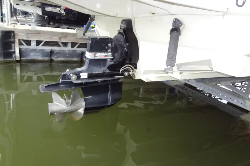 Slide: The Image of 2000 Sea Ray 240 Sundeck boat propeller and stern drive in water. - 28