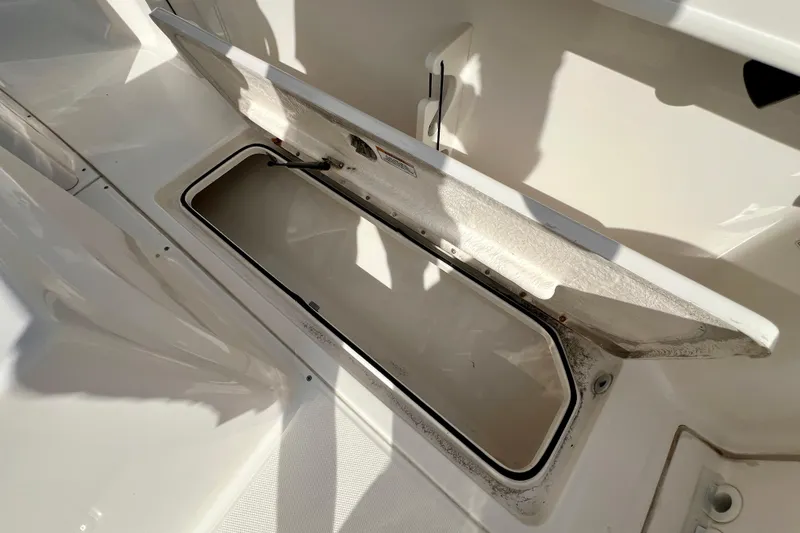 Slide: The Image of Open storage compartment on 2023 Trophy T24CC boat, showcasing interior space. - 13