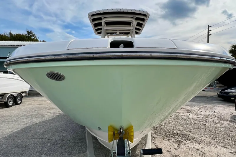 Slide: The Image of 2023 Trophy T24CC boat front view with clear sky background. - 3