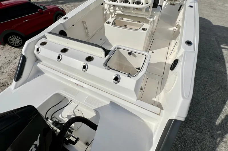 Slide: The Image of 2023 Trophy T24CC boat interior with seating and storage compartments. - 9