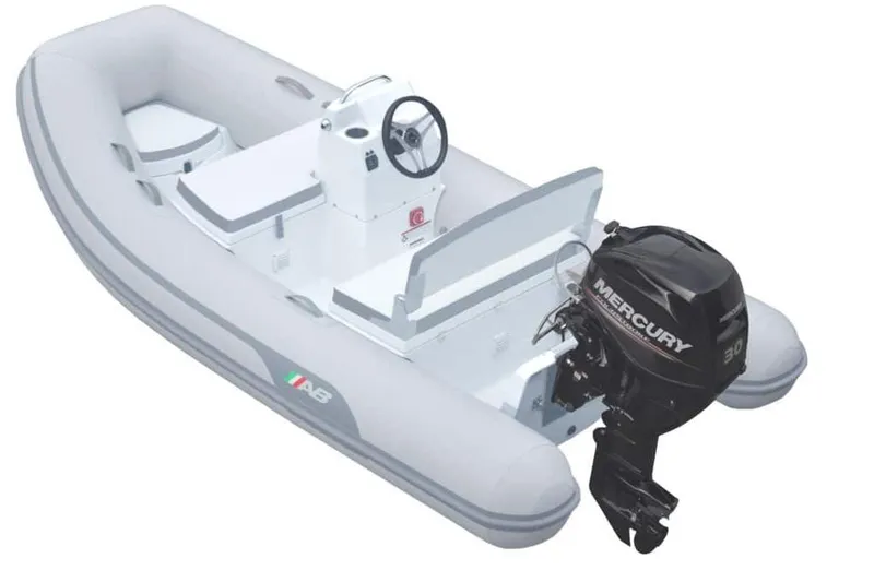 Slide: The Image of 2023 AB 12 vsx inflatable boat with Mercury outboard motor, white and gray design. - 1