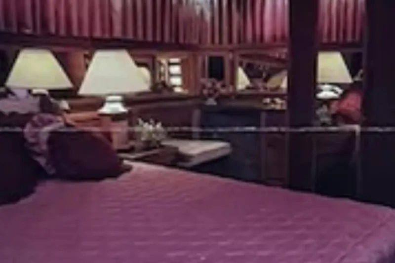 Slide: The Image of Luxurious bedroom interior of 1986 Bluewater 46 MY yacht with elegant decor and ambient lighting. - 15