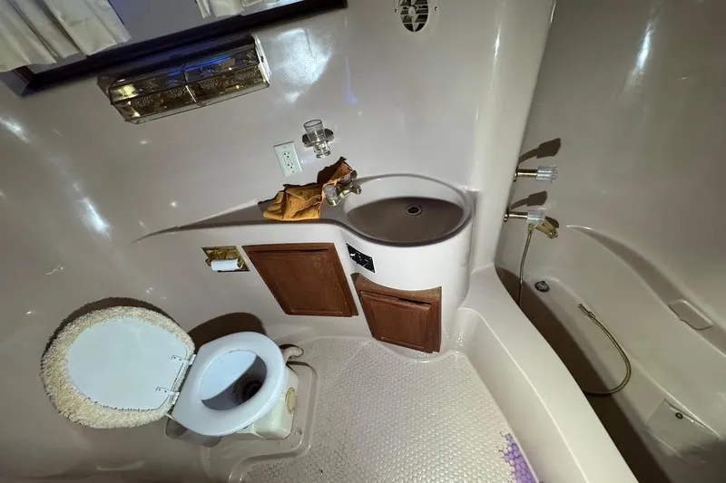 Slide: The Image of Bathroom interior of 1986 Bluewater 46 MY yacht with toilet and sink. - 21