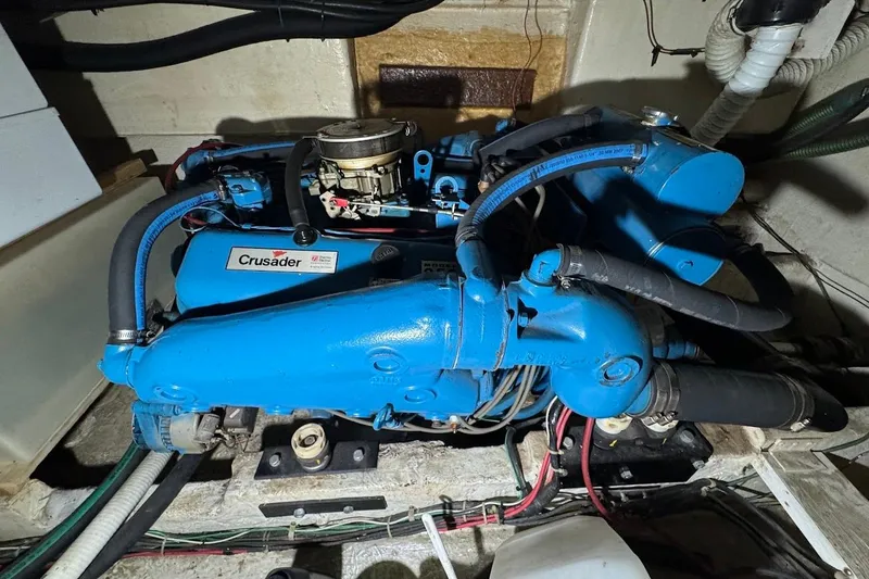 Slide: The Image of Engine compartment of a 1986 Bluewater 46 MY with a Crusader engine. - 25