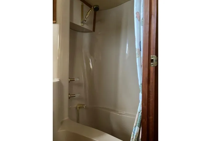 Slide: The Image of 1986 Bluewater 46 MY yacht bathroom with shower and curtain. - 28