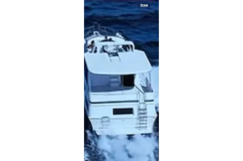 Slide: The Image of 1986 Bluewater 46 MY yacht cruising on open water. - 4