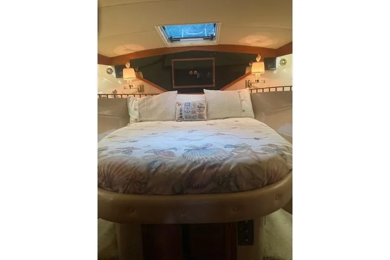 Slide: The Image of Cozy bedroom interior of 1986 Bluewater 46 MY yacht with nautical-themed bedding. - 7