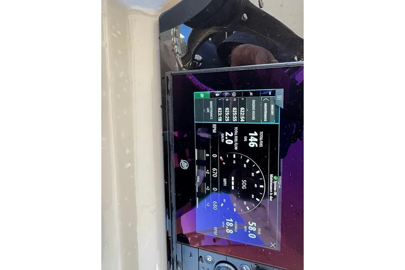 Slide: The Image of Dashboard display of a 2020 Boston Whaler 420 Outrage showing engine metrics and fuel data. - 20