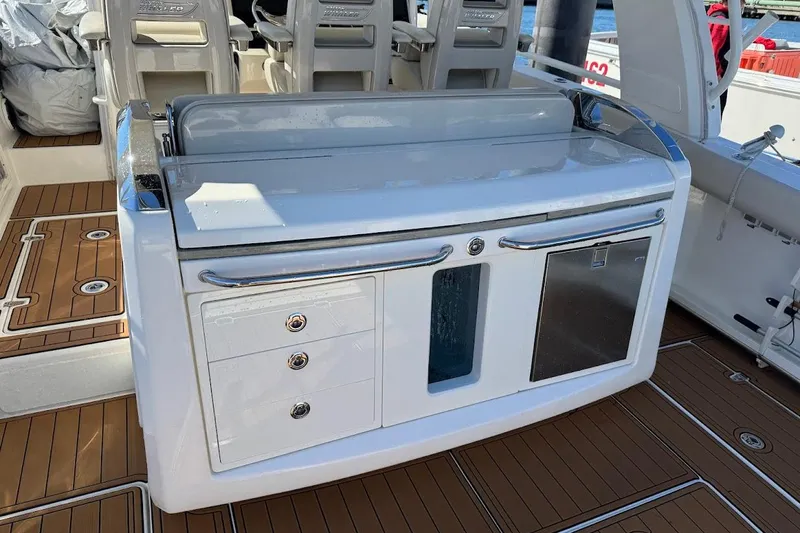 Slide: The Image of 2020 Boston Whaler 420 Outrage boat interior with sleek cabinetry and seating. - 30