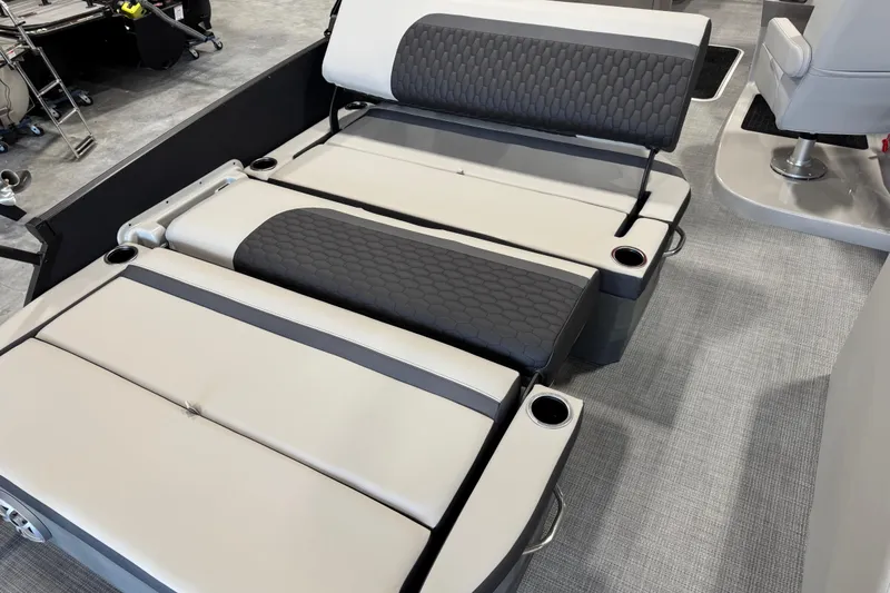 Slide: The Image of Luxurious seating on 2026 Sylvan L-5 Platinum boat with cup holders and modern design. - 12