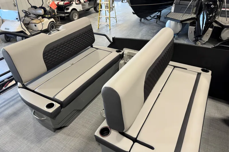 Slide: The Image of 2026 Sylvan L-5 Platinum boat seats, gray and black upholstery, cup holders, indoor showroom. - 13