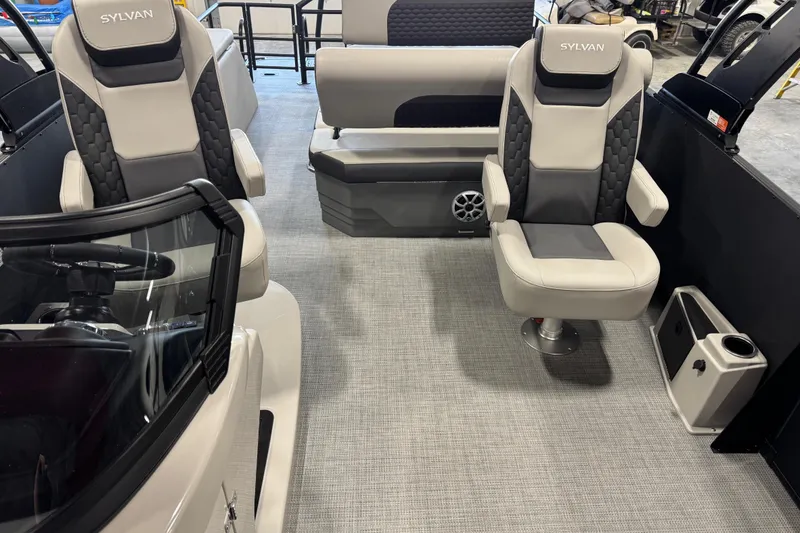 Slide: The Image of Interior of 2026 Sylvan L-5 Platinum boat with modern seating and steering console. - 14