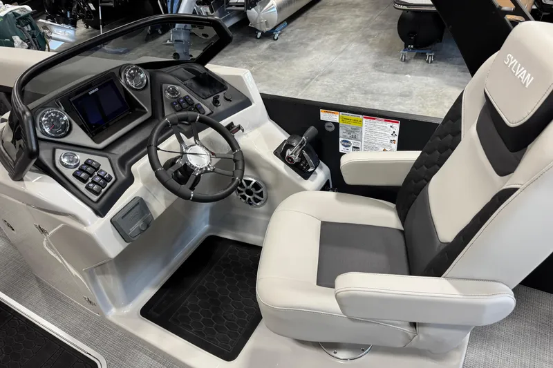Slide: The Image of 2026 Sylvan L-5 Platinum boat cockpit with modern steering and controls. - 17