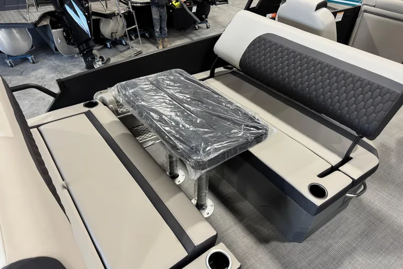 Slide: The Image of Interior of 2026 Sylvan L-5 Platinum pontoon boat with seating and table. - 18